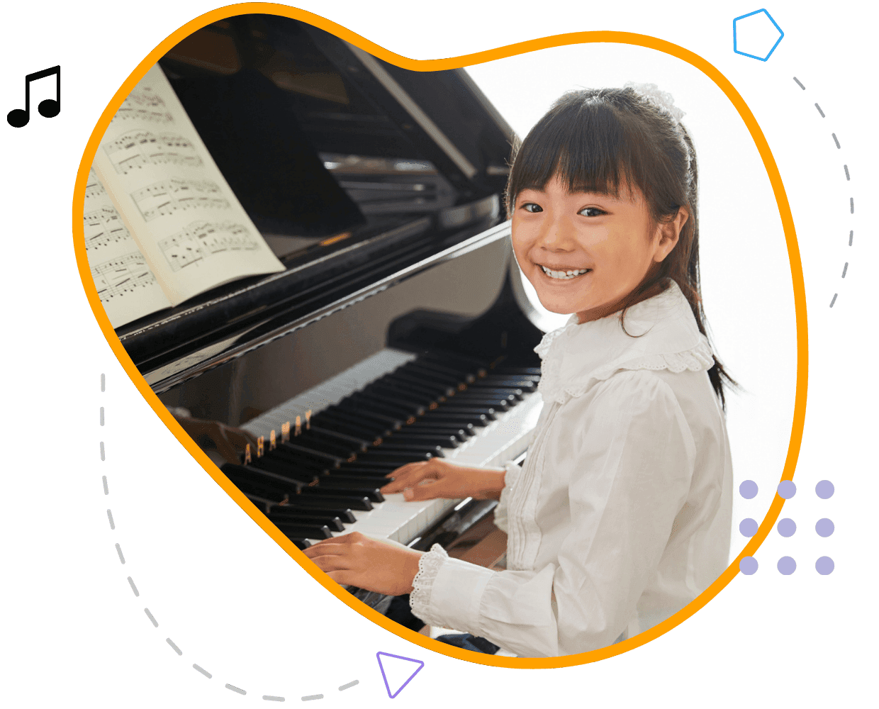 A child smiling while playing piano